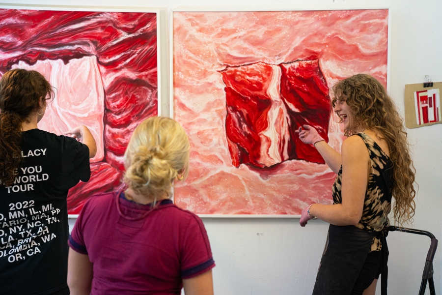 MFA student Izzy Losskarn welcomes guests in the graduate studios at the Lamar Dodd School of Art, fall 2024