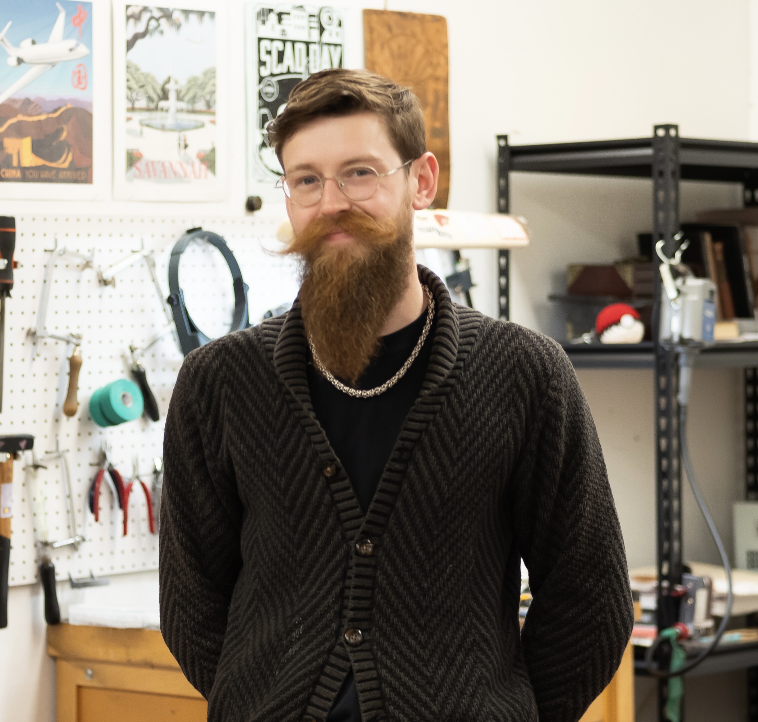 Portrait of Miller Wright standing in a studio space